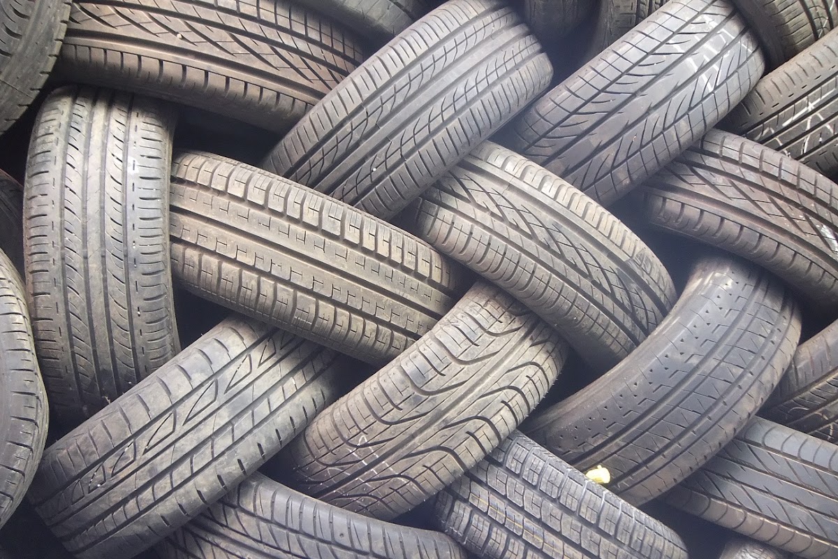 Woven stack of used tyres in the yard