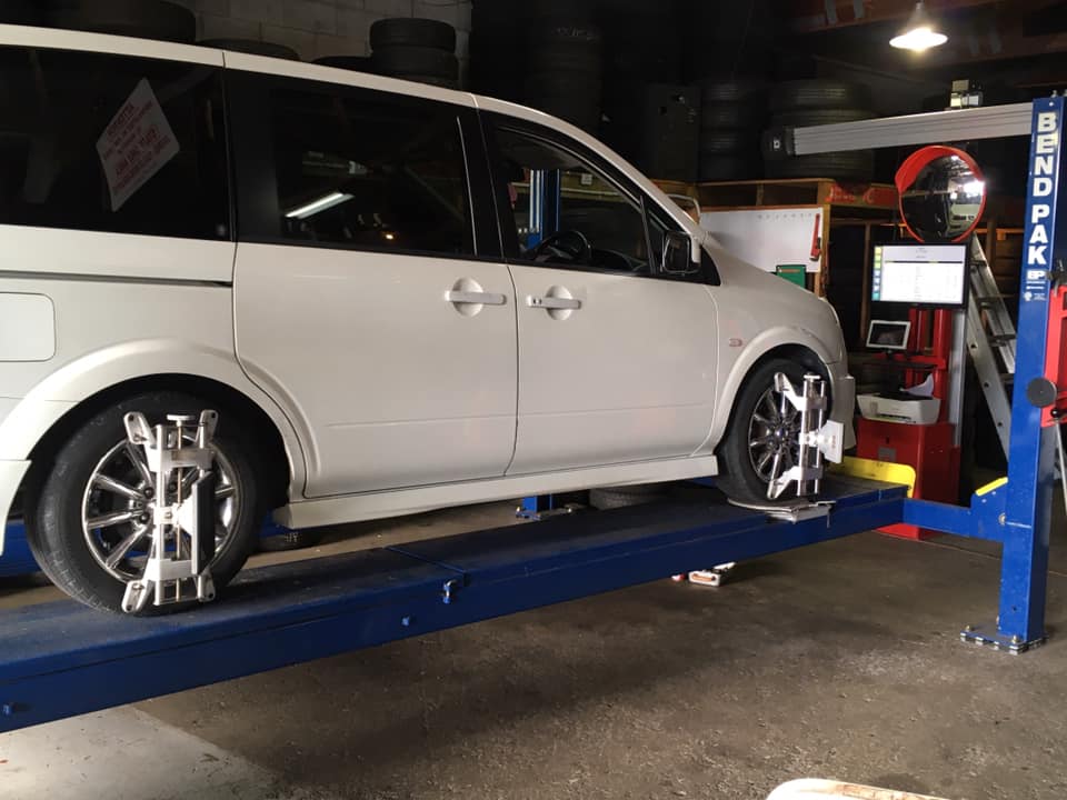 Van on the four wheel alignment rig